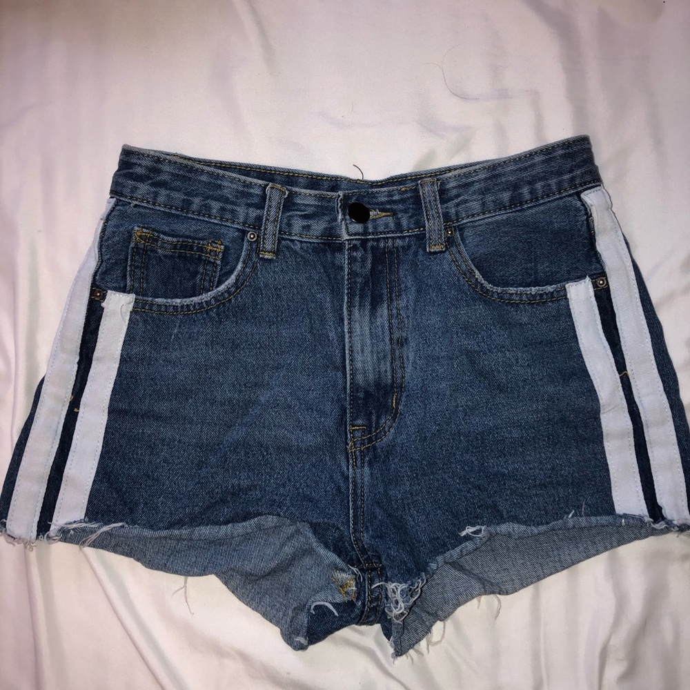 SOLD Nasty Gal blue denim shorts with white stripes on the sides.